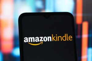 In this photo illustration, the Amazon Kindle logo is seen